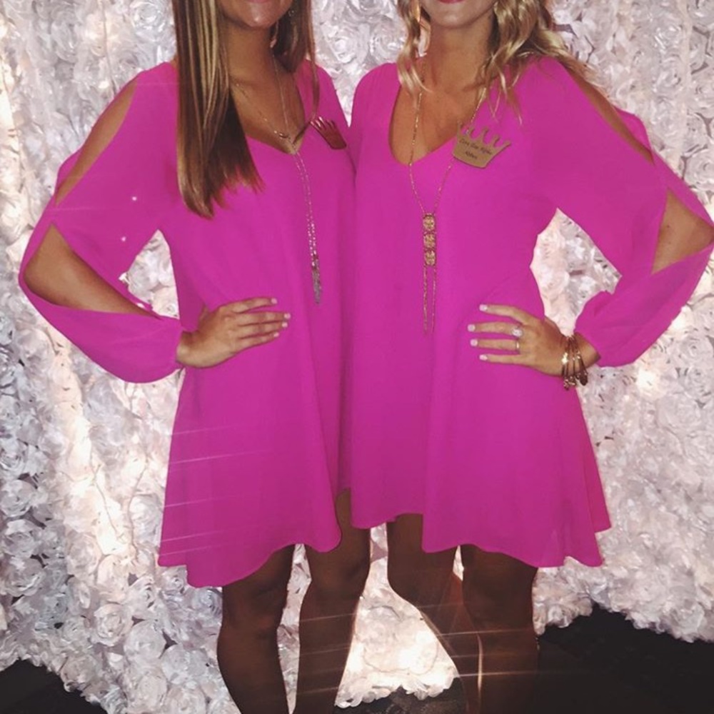 Dress with open arm slits